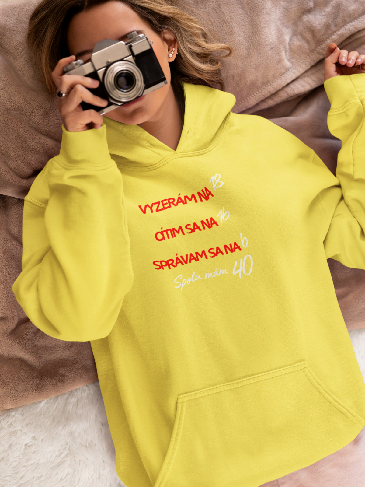 hoodie mockup featuring a woman in bed using a vintage camera m37285